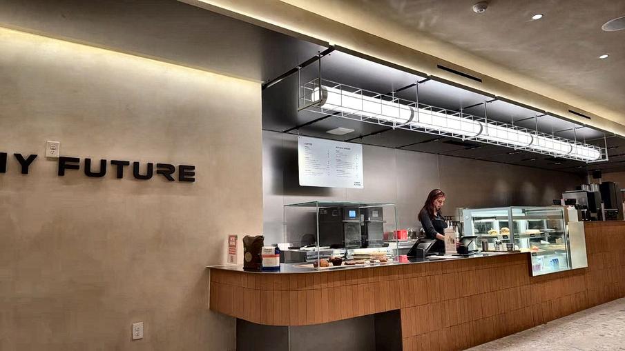 The service counter with the Yummy Future wordmark on the wall behind it