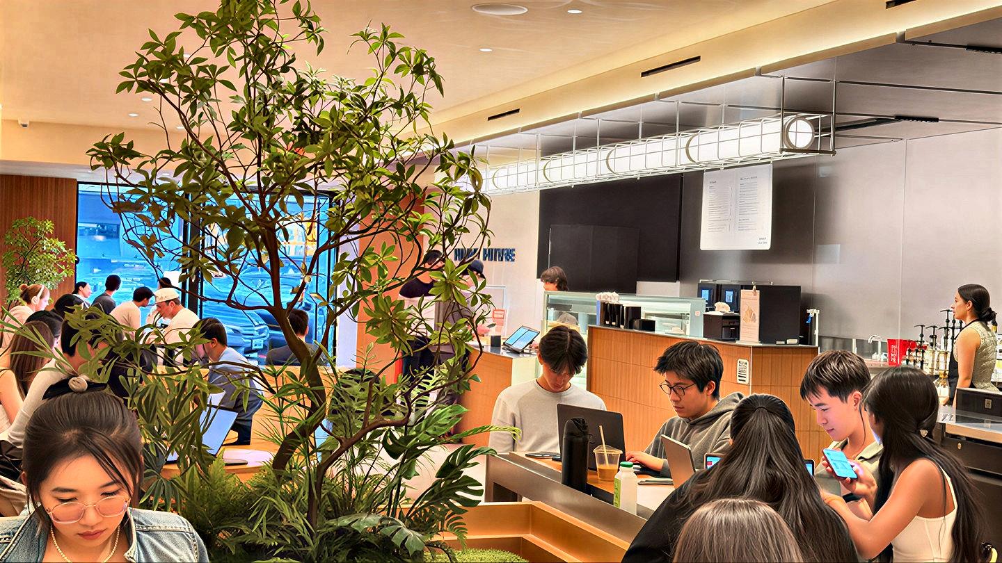 A crowd of customers packed around the counter in the Palo Alto store